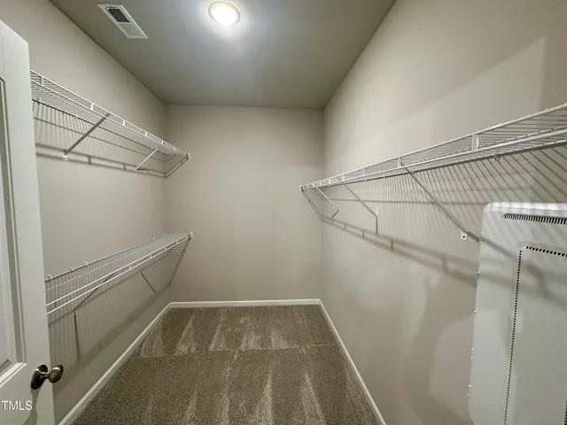 a view of a room with racks on the wall