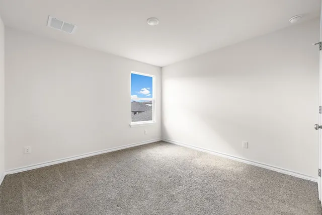 an empty room with a empty space and a window