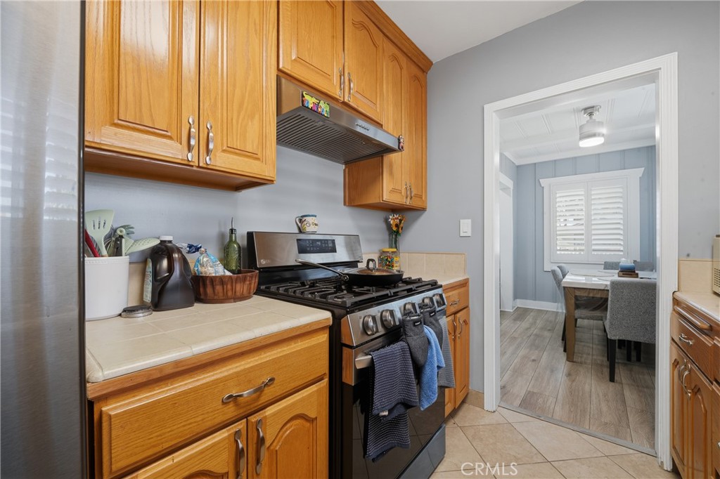 11340 Virginia Street Lynwood, CA 90262 - Photo 11 of 53 a kitchen with stainless steel appliances granite countertop a stove and a sink