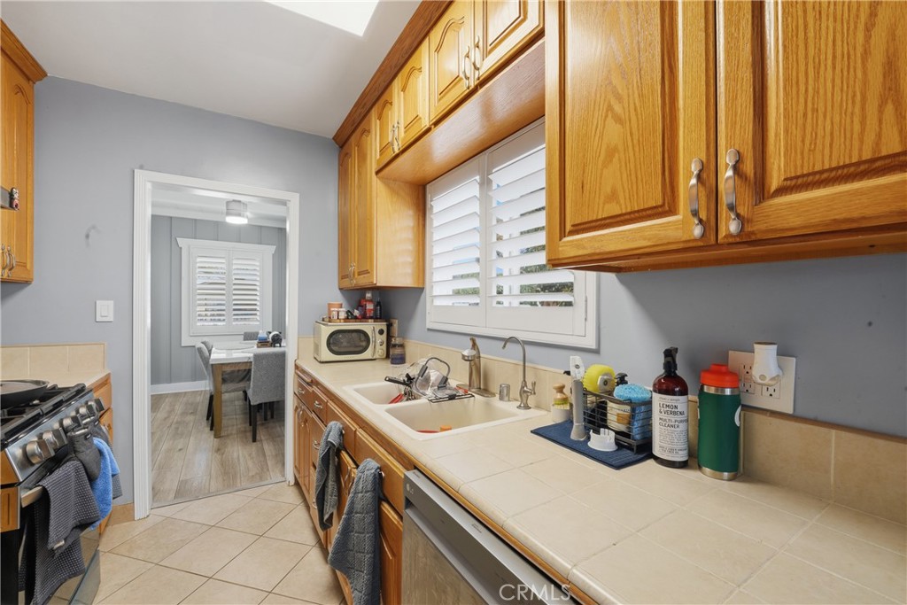 11340 Virginia Street Lynwood, CA 90262 - Photo 12 of 53 a kitchen with a sink and cabinets