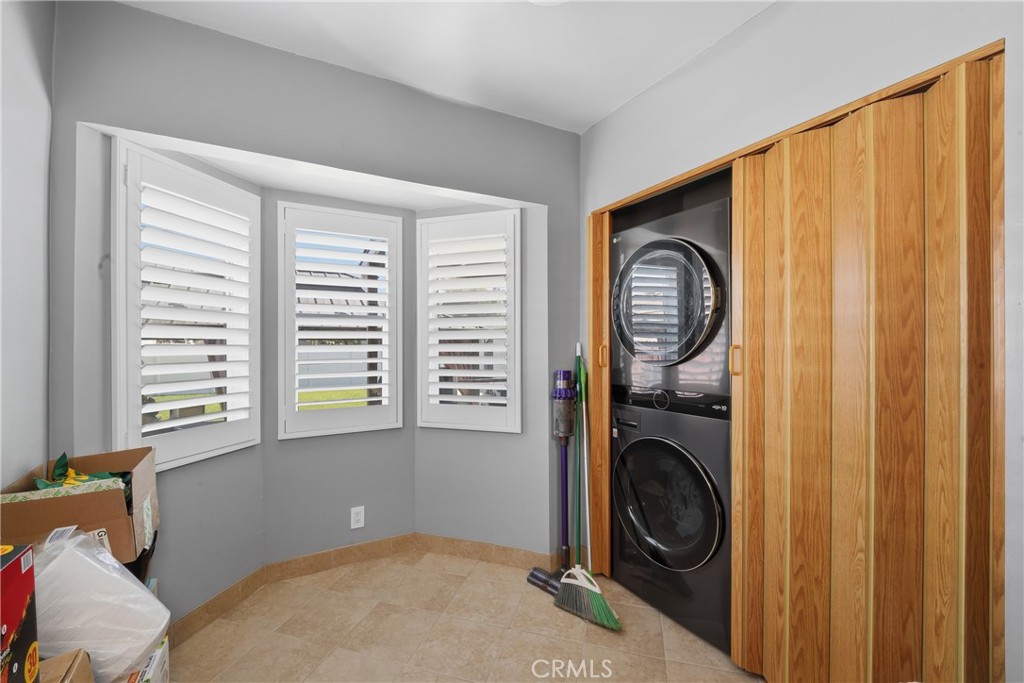 11340 Virginia Street Lynwood, CA 90262 - Photo 14 of 53 a bedroom with a bed and a window