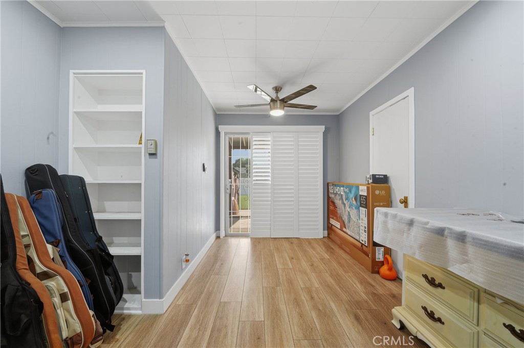 11340 Virginia Street Lynwood, CA 90262 - Photo 24 of 53 a very nice looking room with wooden floor and a ceiling fan