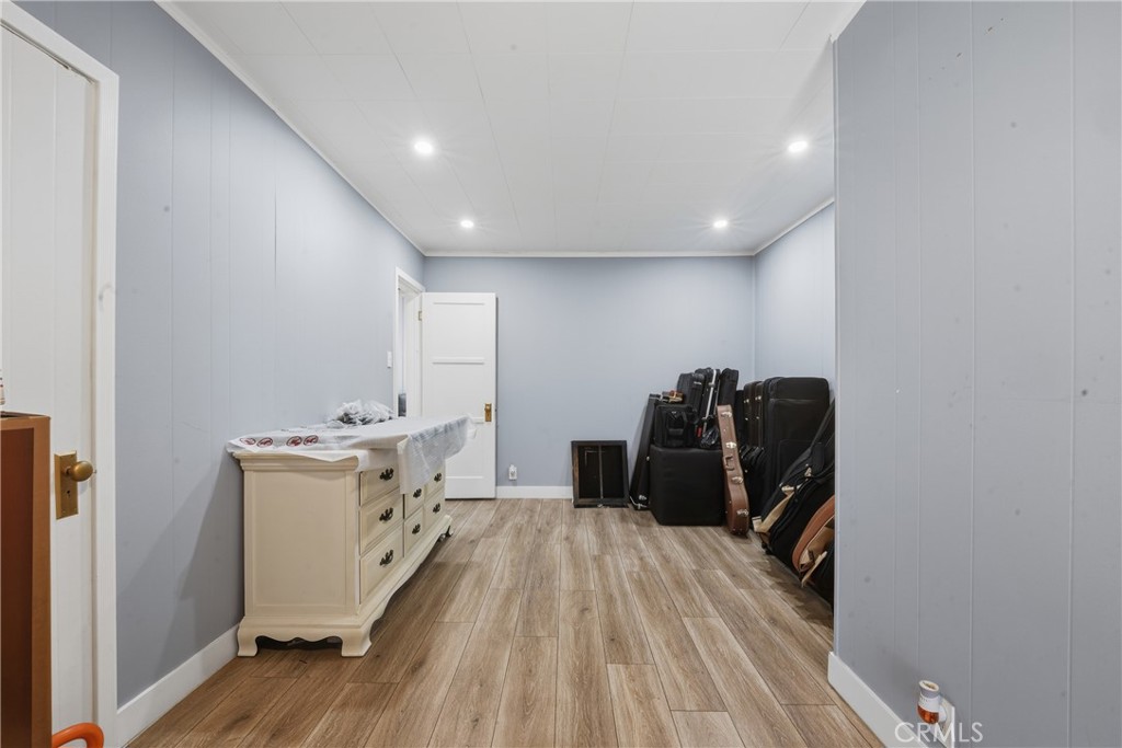 11340 Virginia Street Lynwood, CA 90262 - Photo 27 of 53 a room with a sink and wooden floor