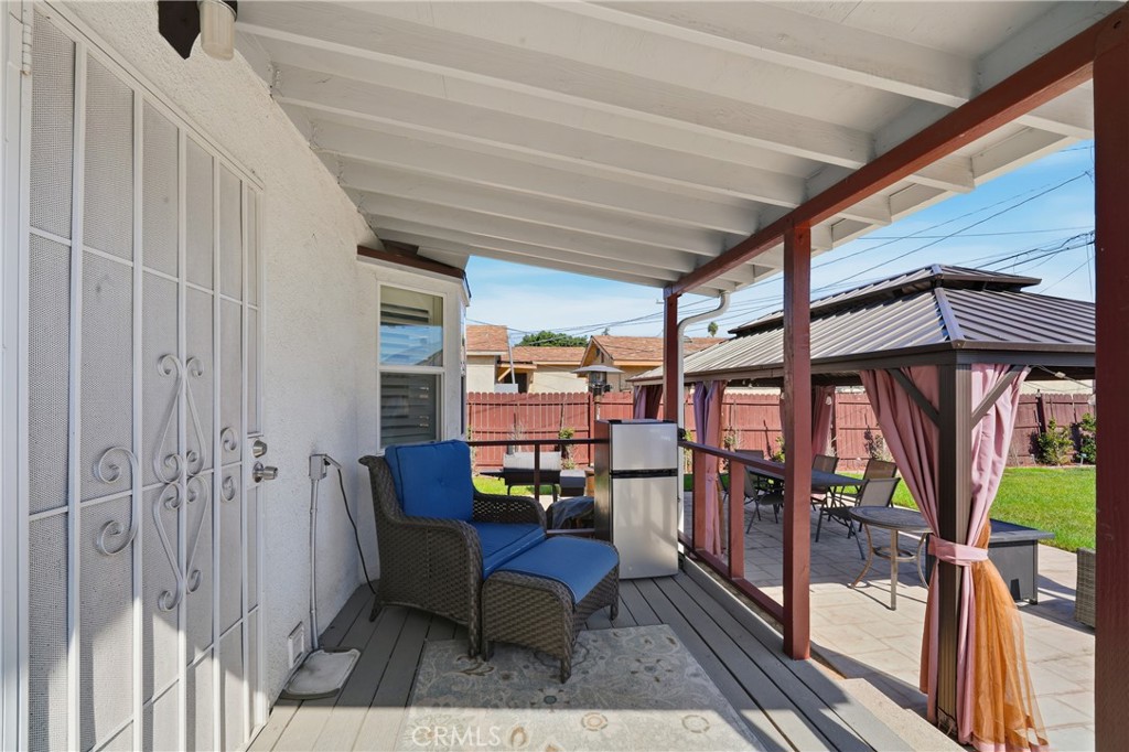 11340 Virginia Street Lynwood, CA 90262 - Photo 28 of 53 a balcony with chairs and table