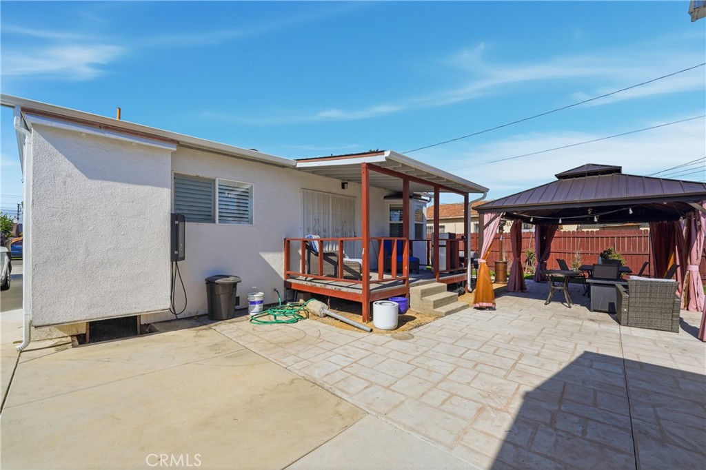 11340 Virginia Street Lynwood, CA 90262 - Photo 33 of 53 a view of a bedroom with porch and furniture