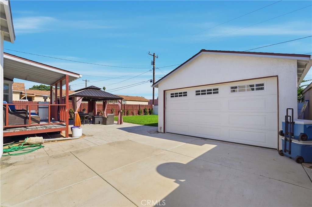 11340 Virginia Street Lynwood, CA 90262 - Photo 40 of 53 a view of a house with a yard and garage