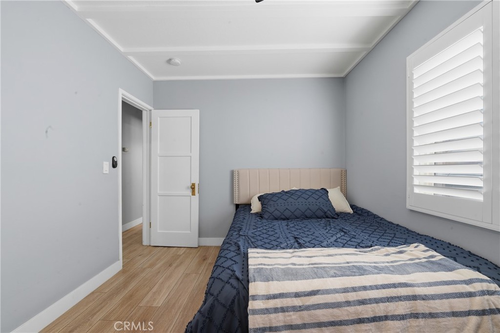 11340 Virginia Street Lynwood, CA 90262 - Photo 43 of 53 a bedroom with a bed and wooden floor