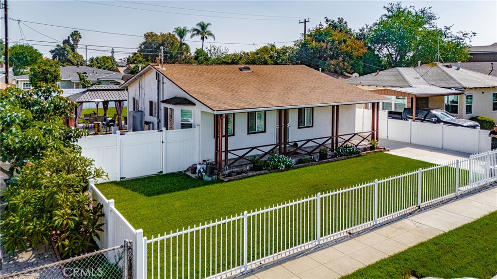 11340 Virginia Street Lynwood, CA 90262 - Photo 45 of 53 a view of a house with garden and plants