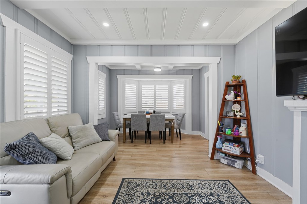 11340 Virginia Street Lynwood, CA 90262 - Photo 7 of 53 a living room with furniture and a flat screen tv