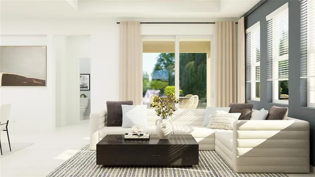 a living room with furniture and a large window