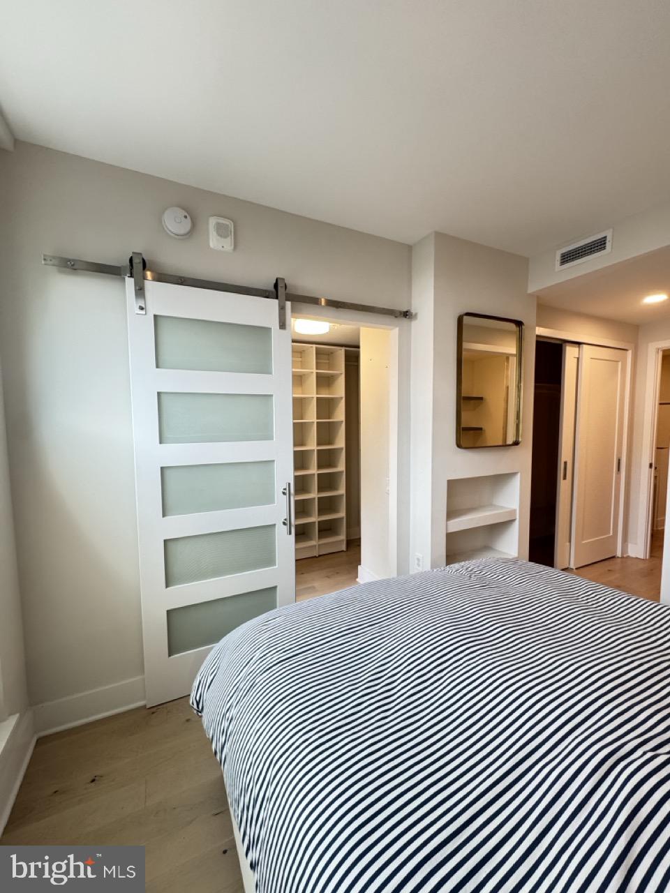 1211 Van Street Southeast, Unit TH1H Washington, DC 20003 - Photo 3 of 53 Barn door to walk-in closet.