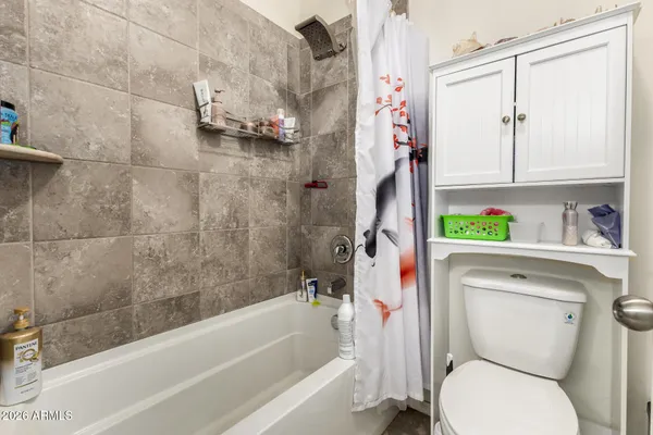 a bathroom with a sink a toilet and a bathtub