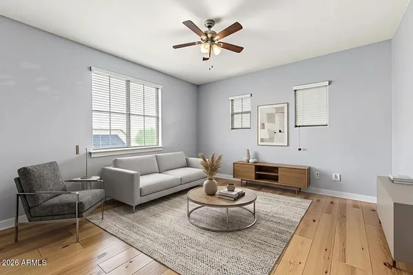 a living room with furniture and a large window