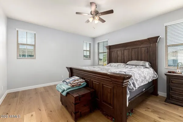a bed sitting in a bedroom next to a window