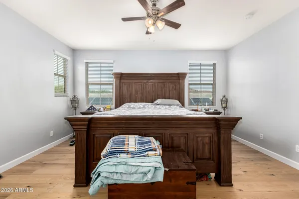 a bedroom with a bed and window