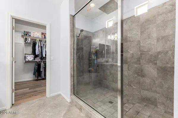 a bathroom with a glass shower door