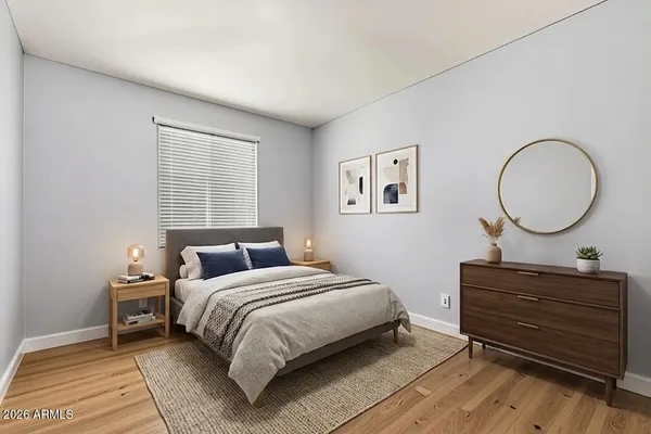a bedroom with a bed and a dresser