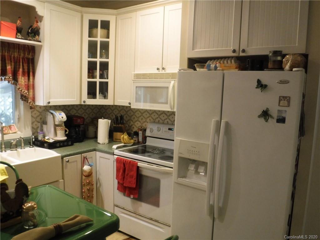 206 Callahan Street Rutherfordton, NC 28139 - Photo 12 of 48 a kitchen with stainless steel appliances a refrigerator and a stove