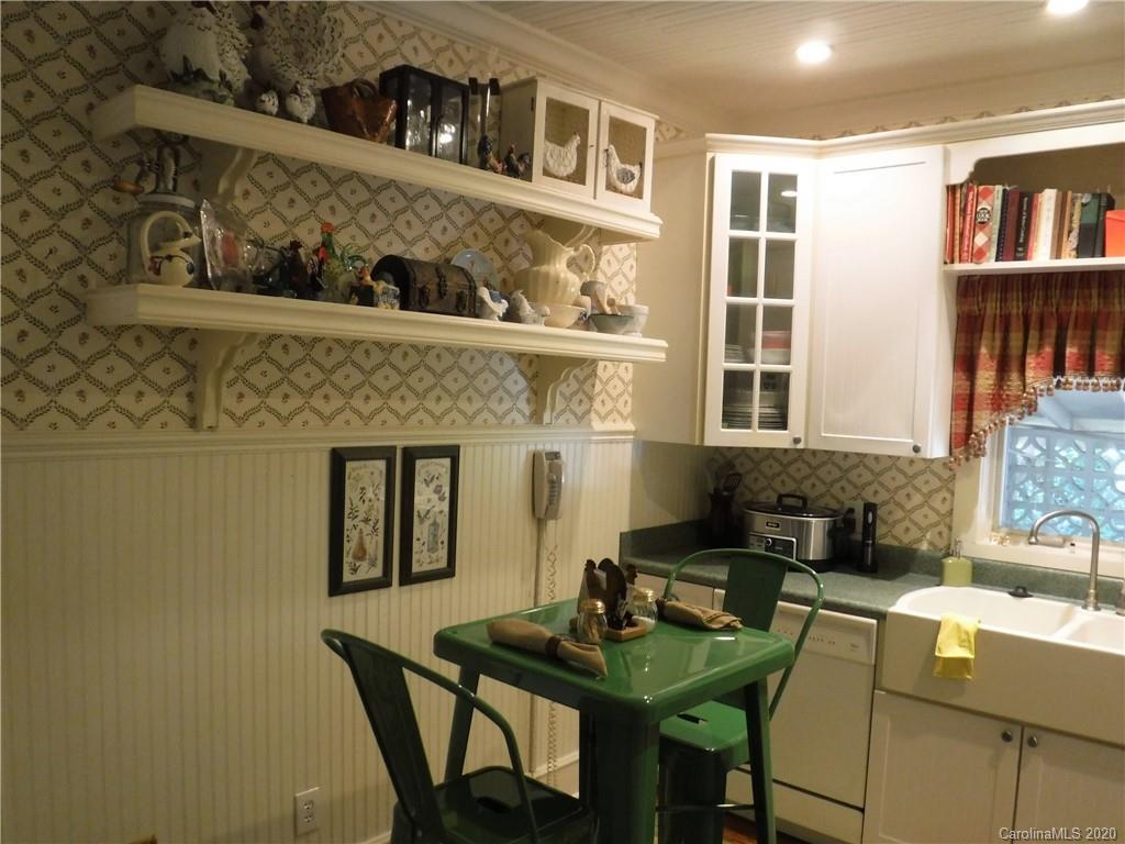 206 Callahan Street Rutherfordton, NC 28139 - Photo 13 of 48 a kitchen with a table and chairs in it