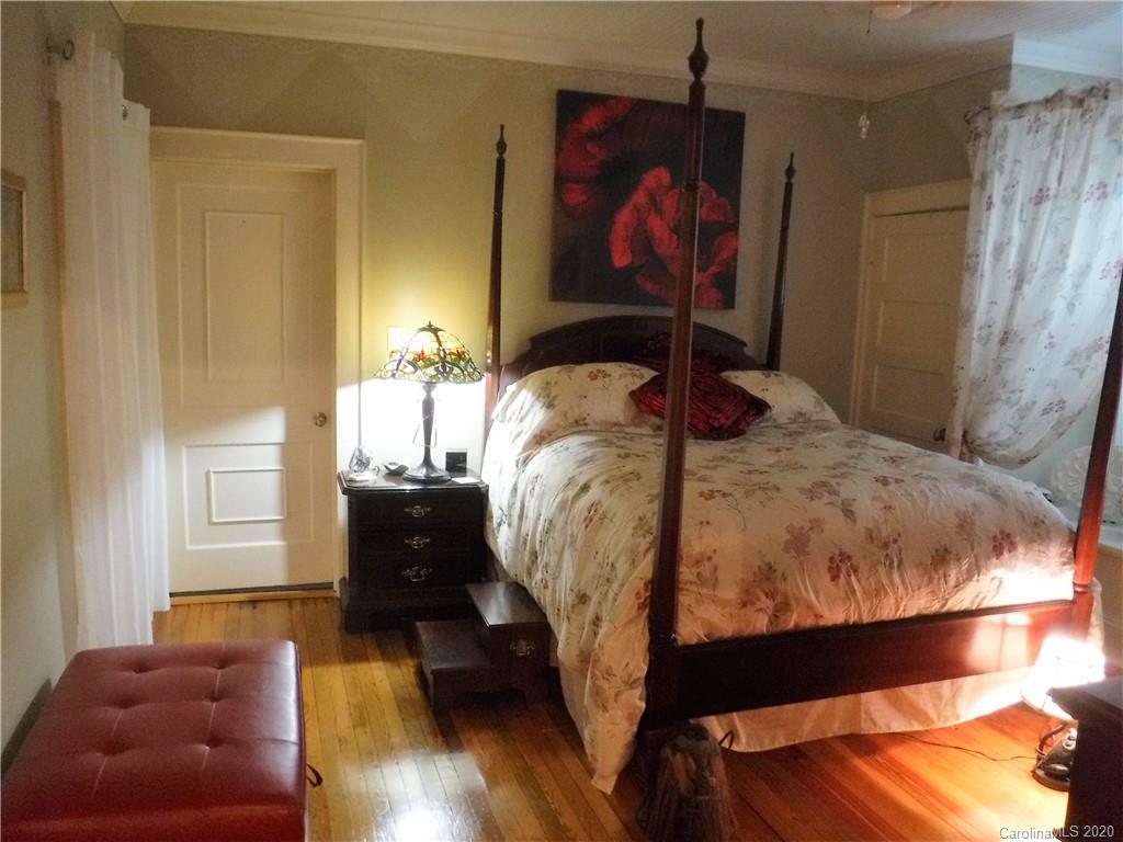 206 Callahan Street Rutherfordton, NC 28139 - Photo 19 of 48 a bed sitting in a bedroom next to a window