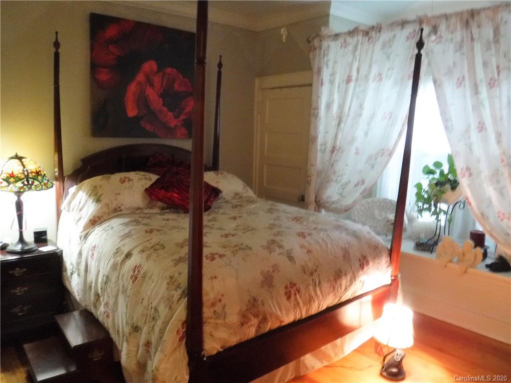 206 Callahan Street Rutherfordton, NC 28139 - Photo 20 of 48 a bed sitting in a bedroom next to a window
