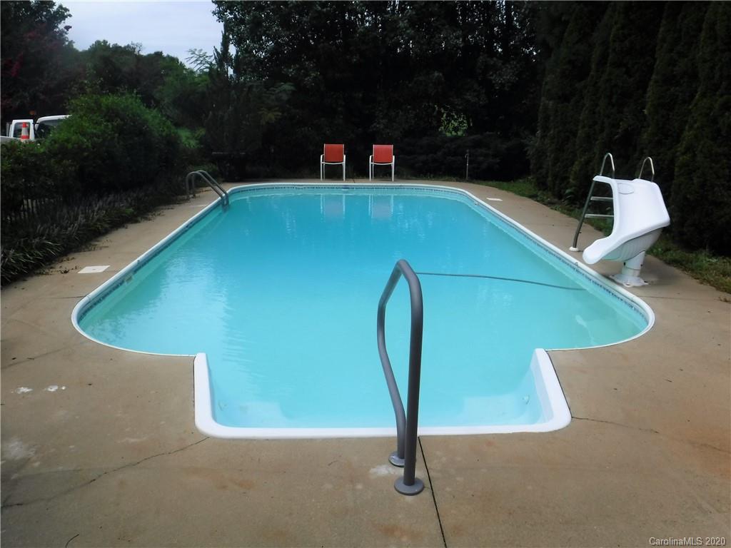 206 Callahan Street Rutherfordton, NC 28139 - Photo 3 of 48 a view of a swimming pool with a yard