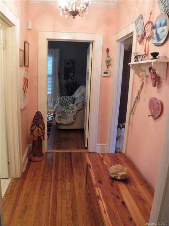 206 Callahan Street Rutherfordton, NC 28139 - Photo 29 of 48 a bedroom with a bed and a mirror