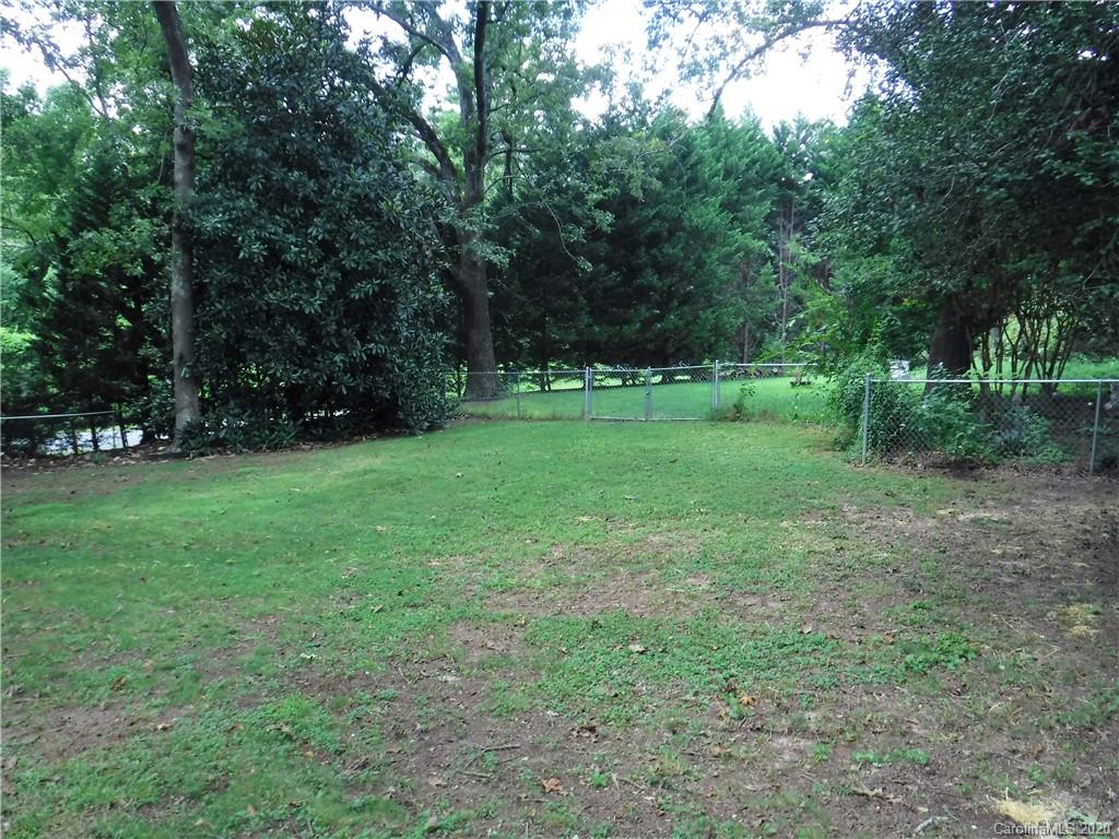 206 Callahan Street Rutherfordton, NC 28139 - Photo 41 of 48 a view of a grassy field with trees in the background