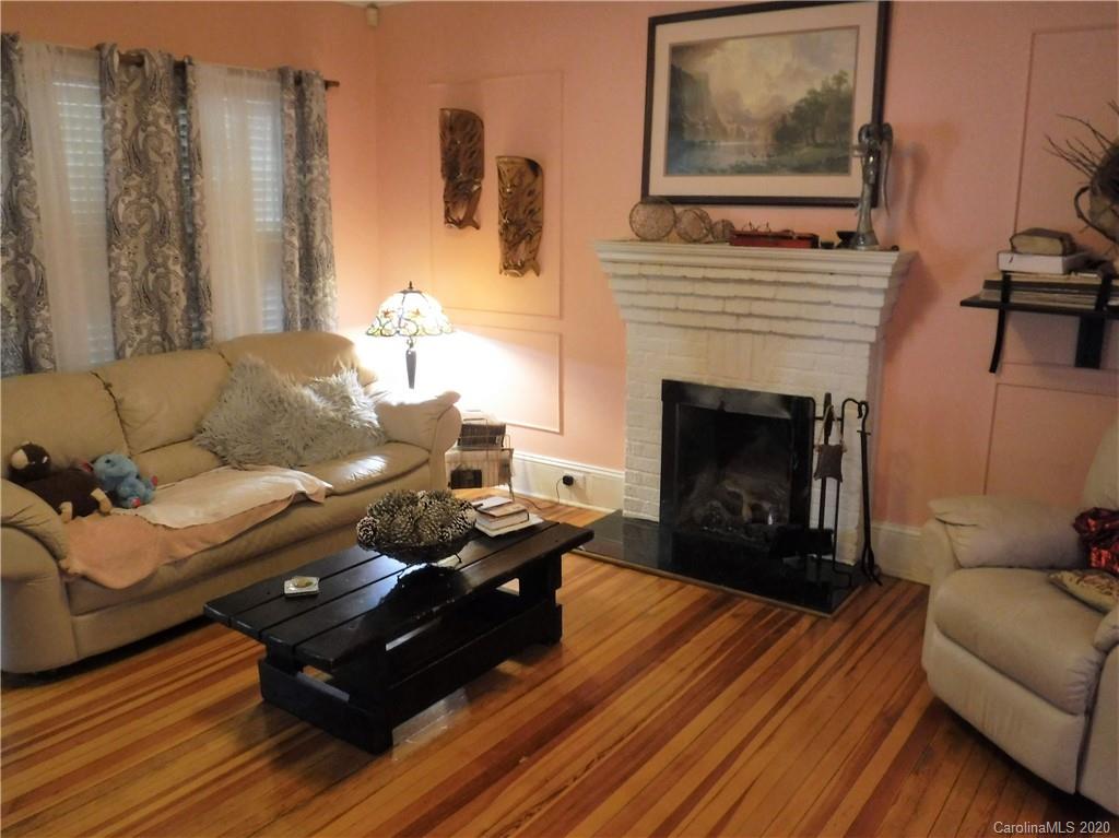 206 Callahan Street Rutherfordton, NC 28139 - Photo 6 of 48 a living room with furniture and a fireplace