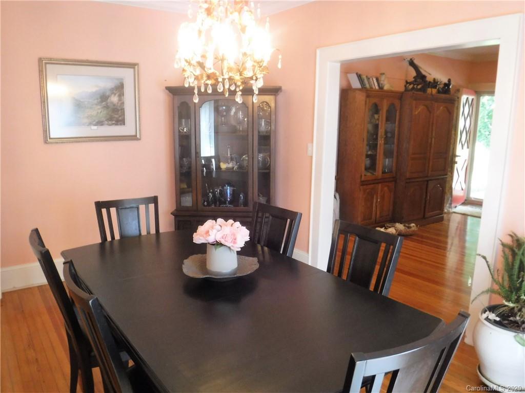 206 Callahan Street Rutherfordton, NC 28139 - Photo 8 of 48 a view of a dining room with furniture and wooden floor