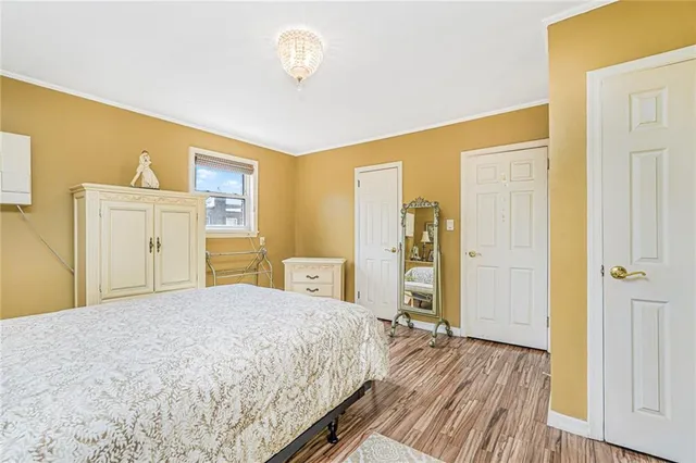 a spacious bedroom with a bed and a table