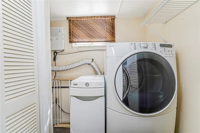 a utility room with dryer and washer