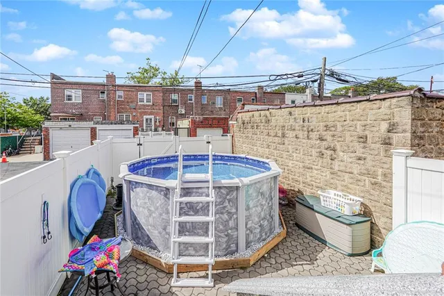 a view of a balcony with table and chairs