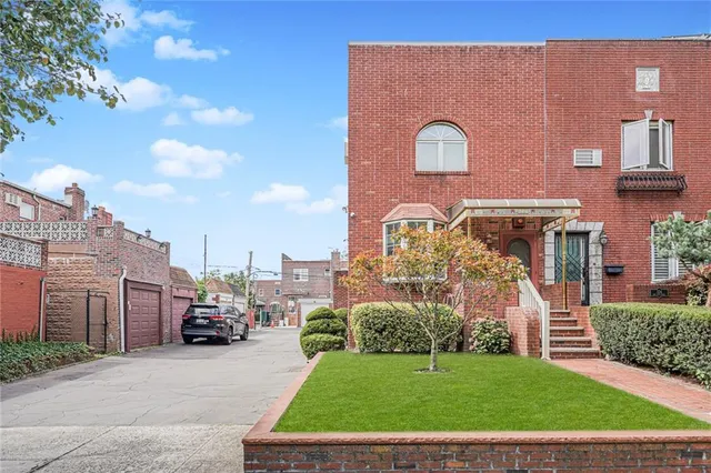 a view of a building with a yard