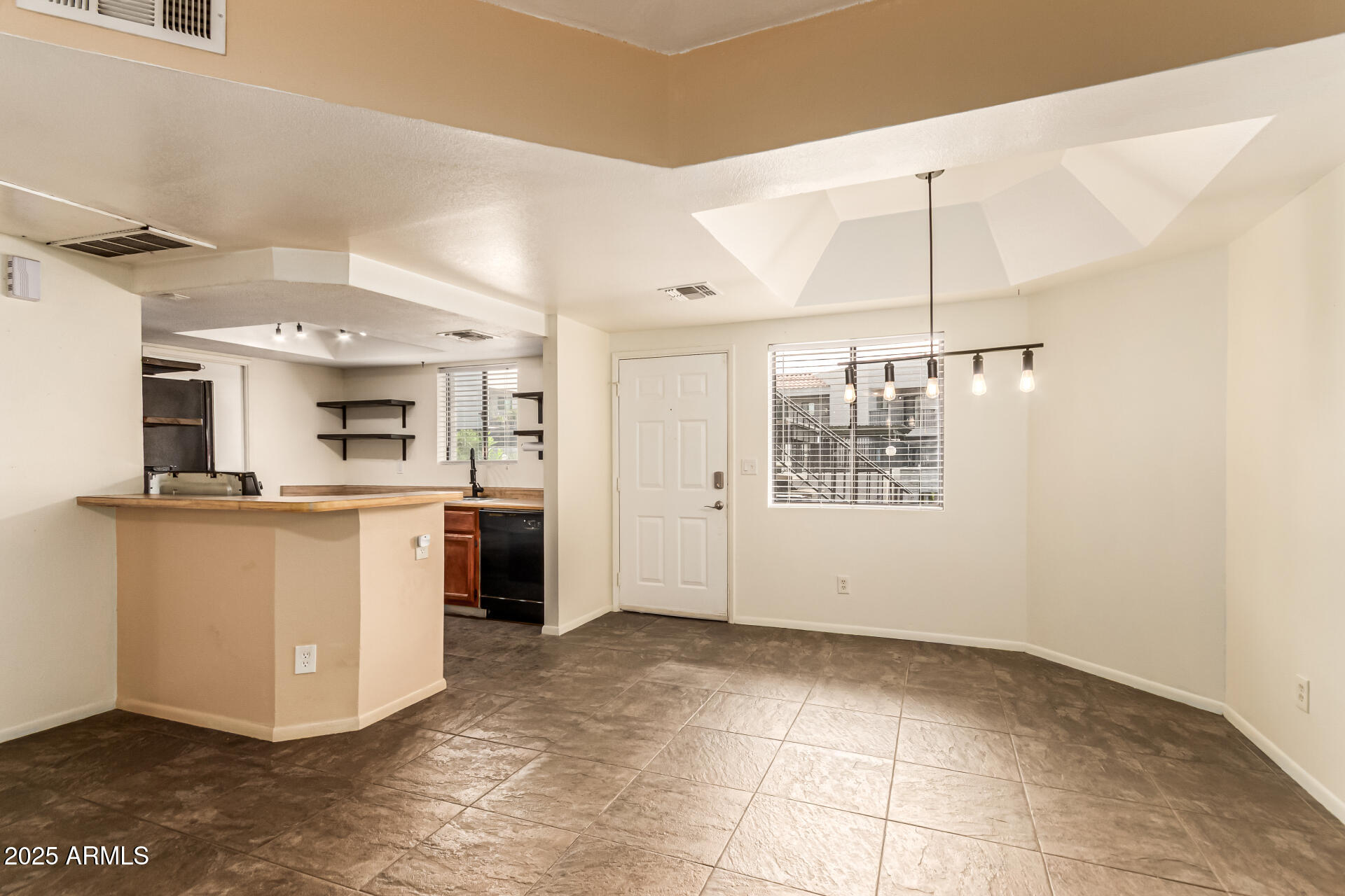 1352 East Highland Avenue, Unit 117 Phoenix, AZ 85014 - Photo 11 of 25 a view of kitchen with furniture and window