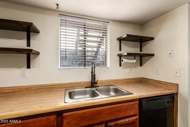 a kitchen with a sink and cabinets