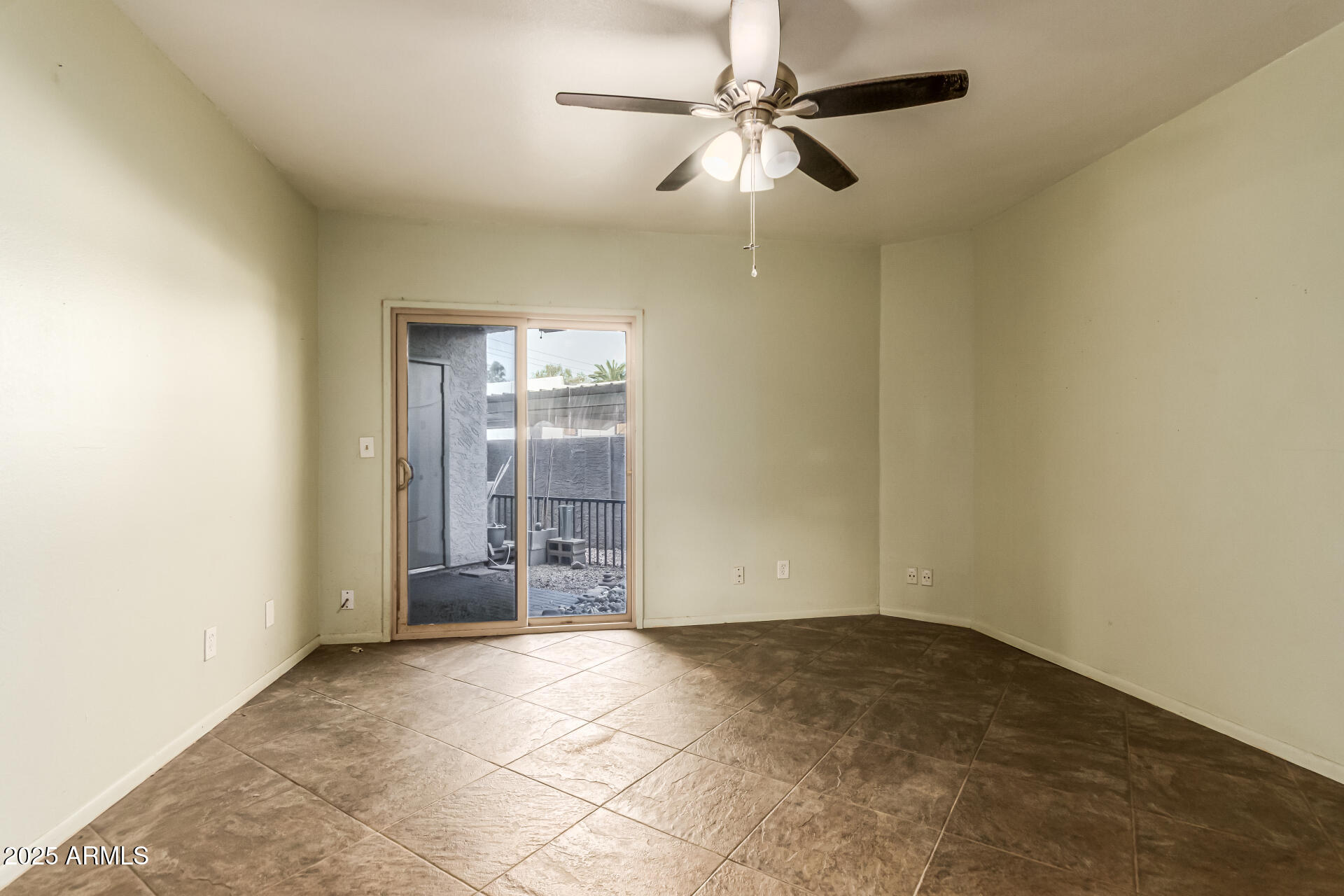 1352 East Highland Avenue, Unit 117 Phoenix, AZ 85014 - Photo 18 of 25 an empty room with closet and ceiling fan