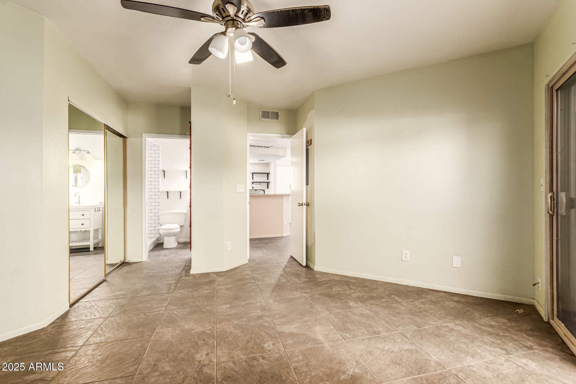 1352 East Highland Avenue, Unit 117 Phoenix, AZ 85014 - Photo 19 of 25 a view of a big room with wooden floor and windows
