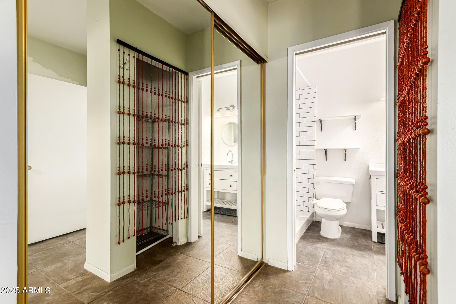 1352 East Highland Avenue, Unit 117 Phoenix, AZ 85014 - Photo 20 of 25 a bathroom with a glass shower door