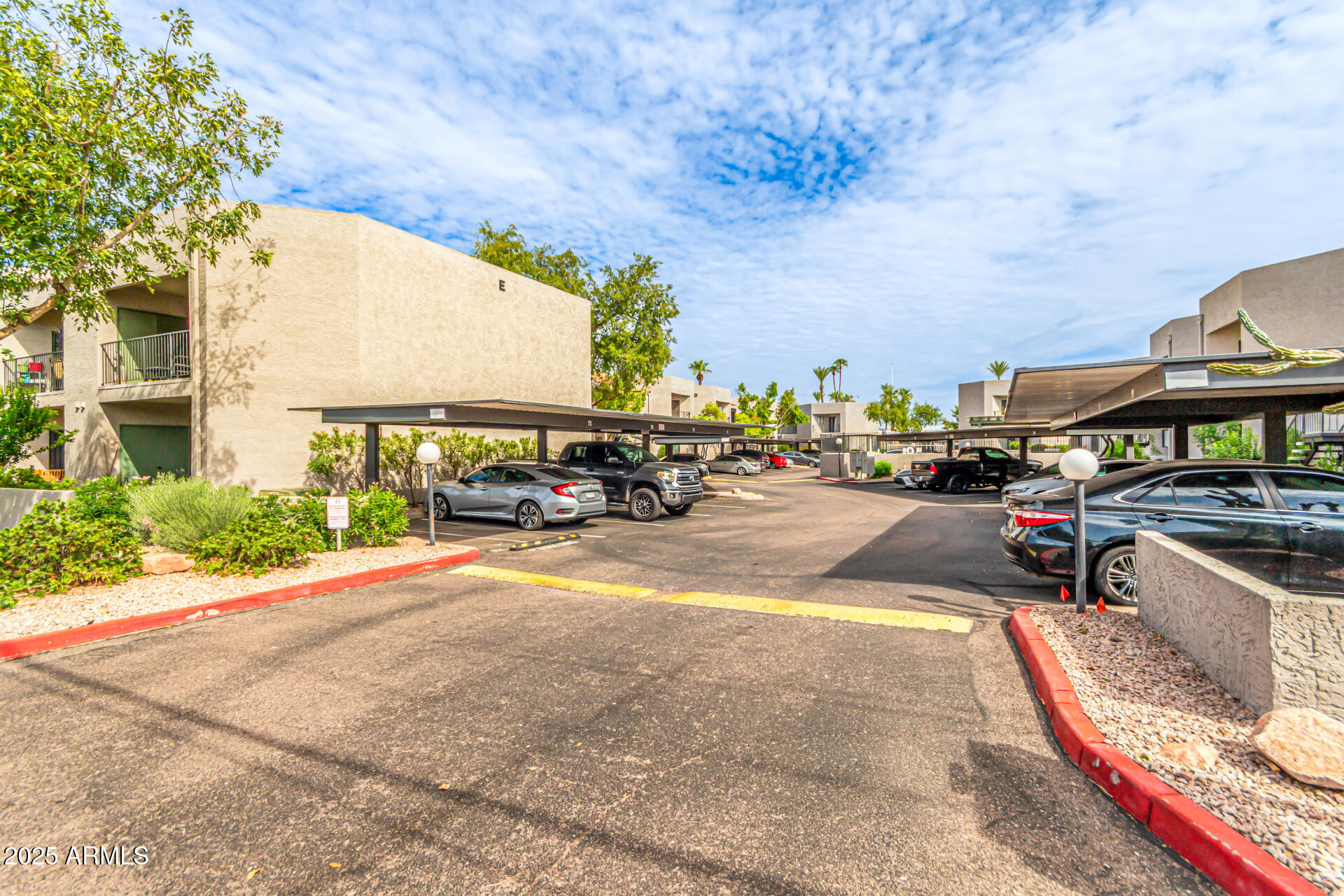 1352 East Highland Avenue, Unit 117 Phoenix, AZ 85014 - Photo 2 of 25 a view of a street with cars