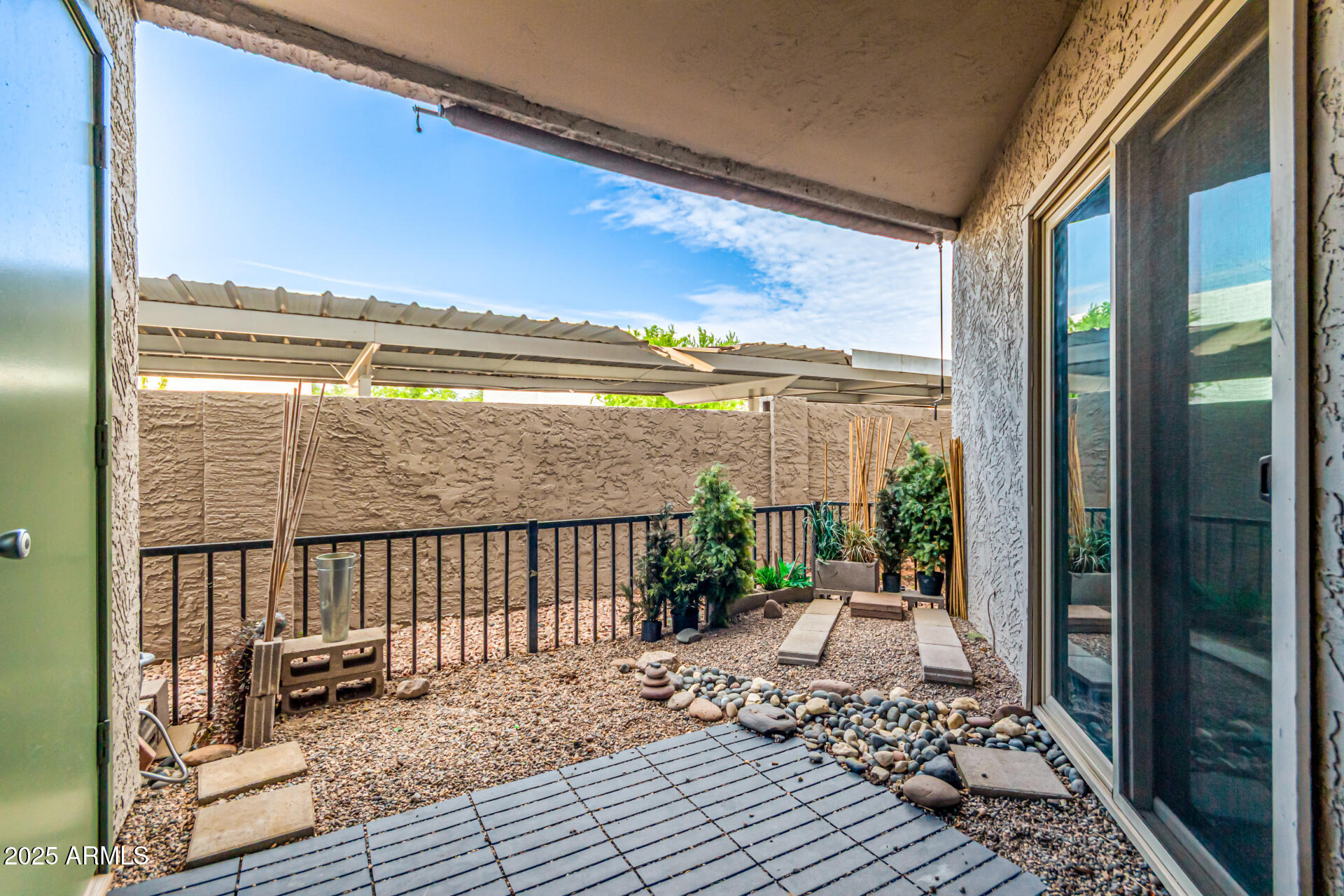 1352 East Highland Avenue, Unit 117 Phoenix, AZ 85014 - Photo 23 of 25 a balcony with wooden floor