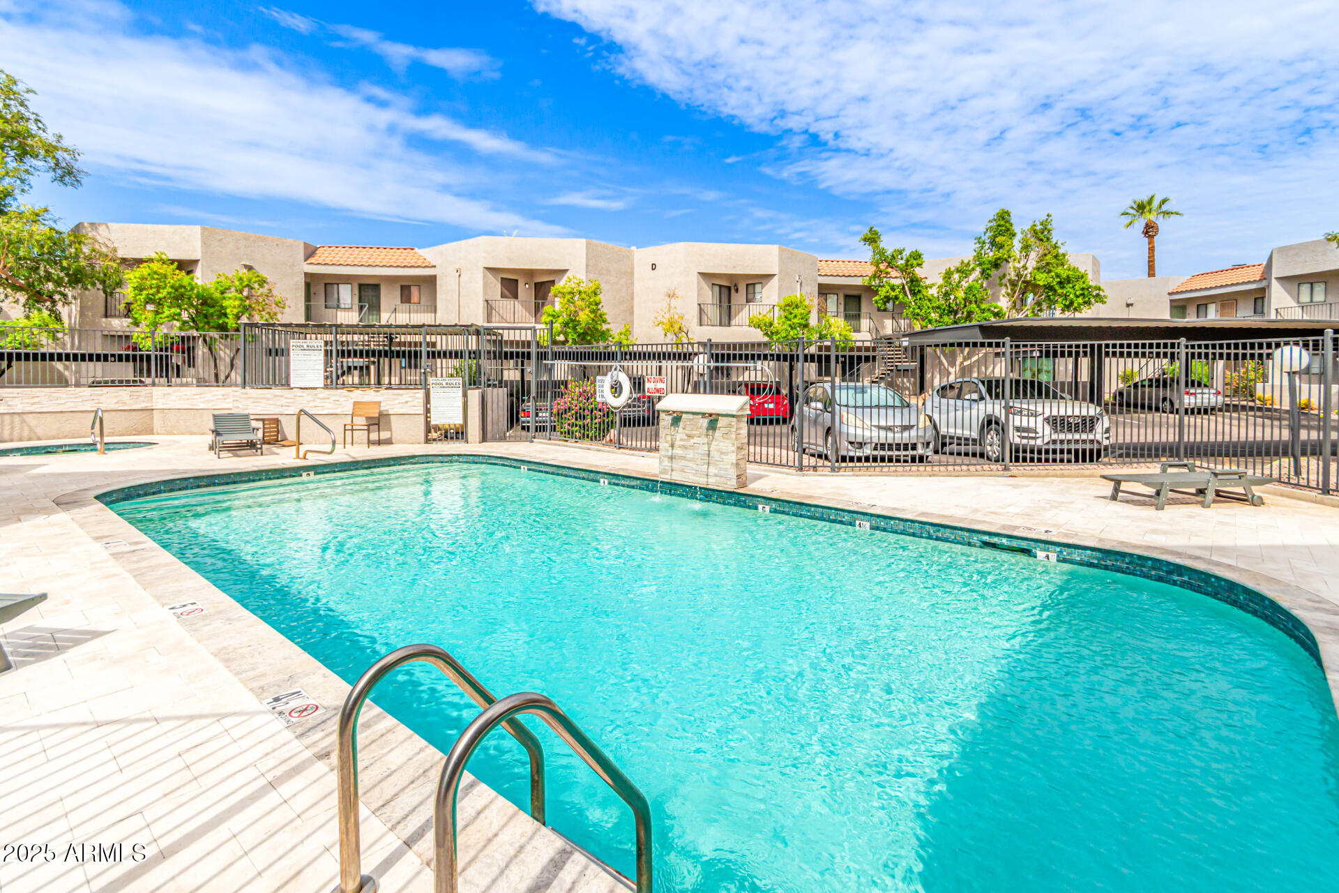 1352 East Highland Avenue, Unit 117 Phoenix, AZ 85014 - Photo 4 of 25 a swimming pool with outdoor seating and yard