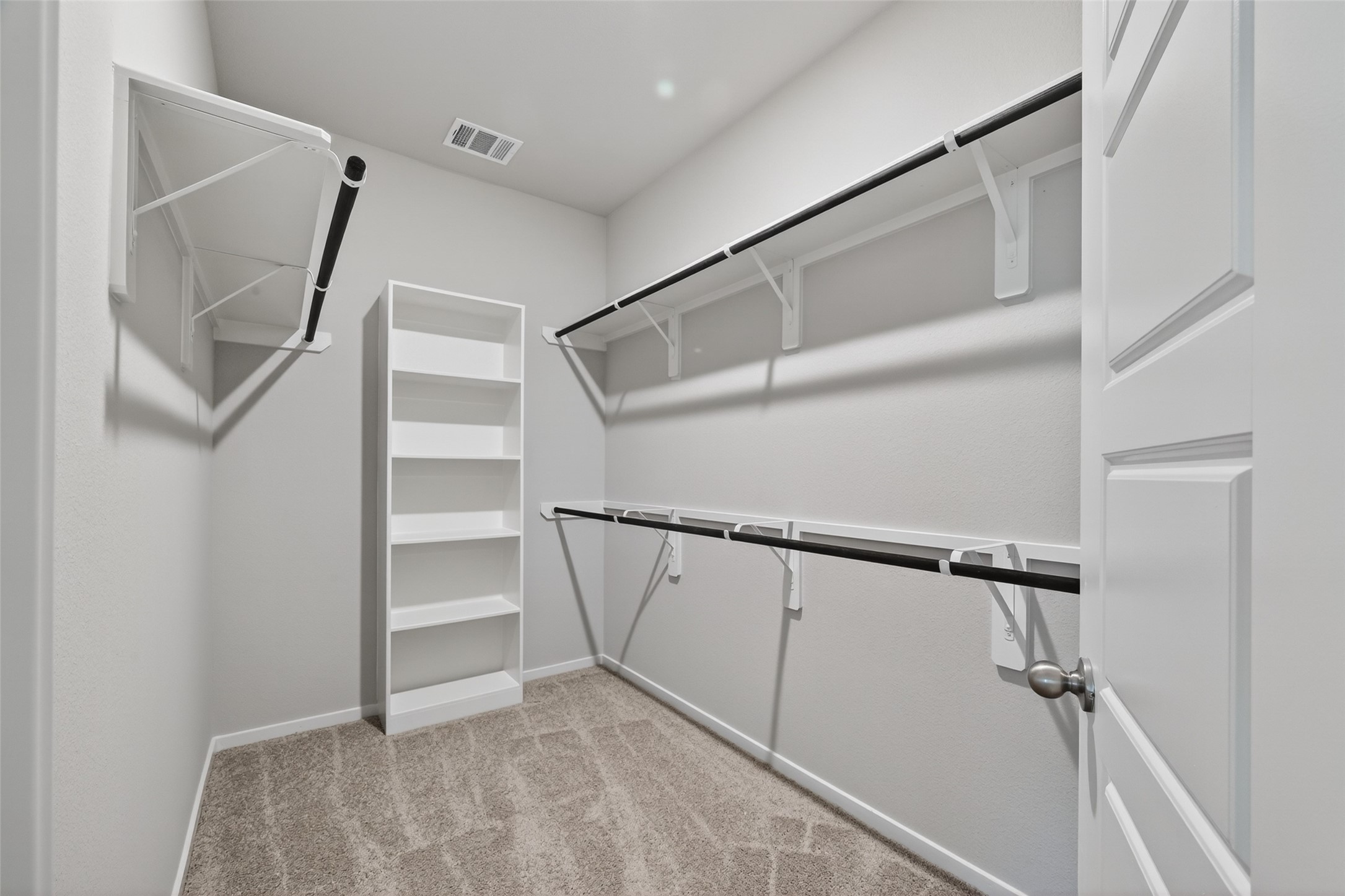 2107 Spring Hollow Drive Baytown, TX 77521 - Photo 24 of 42 a view of staircase with white walls and wooden floor