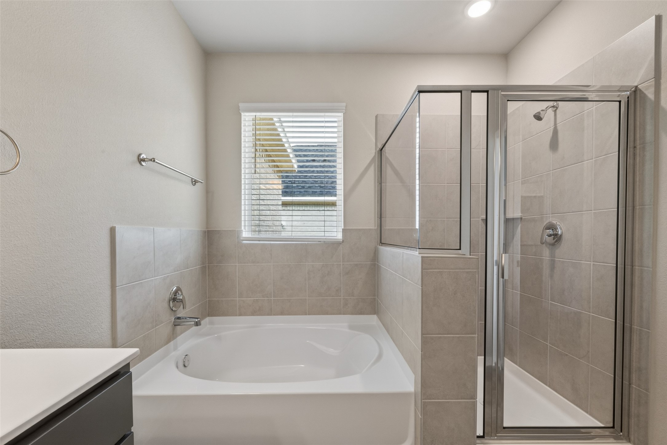 2107 Spring Hollow Drive Baytown, TX 77521 - Photo 25 of 42 a white bath tub sitting next to a shower