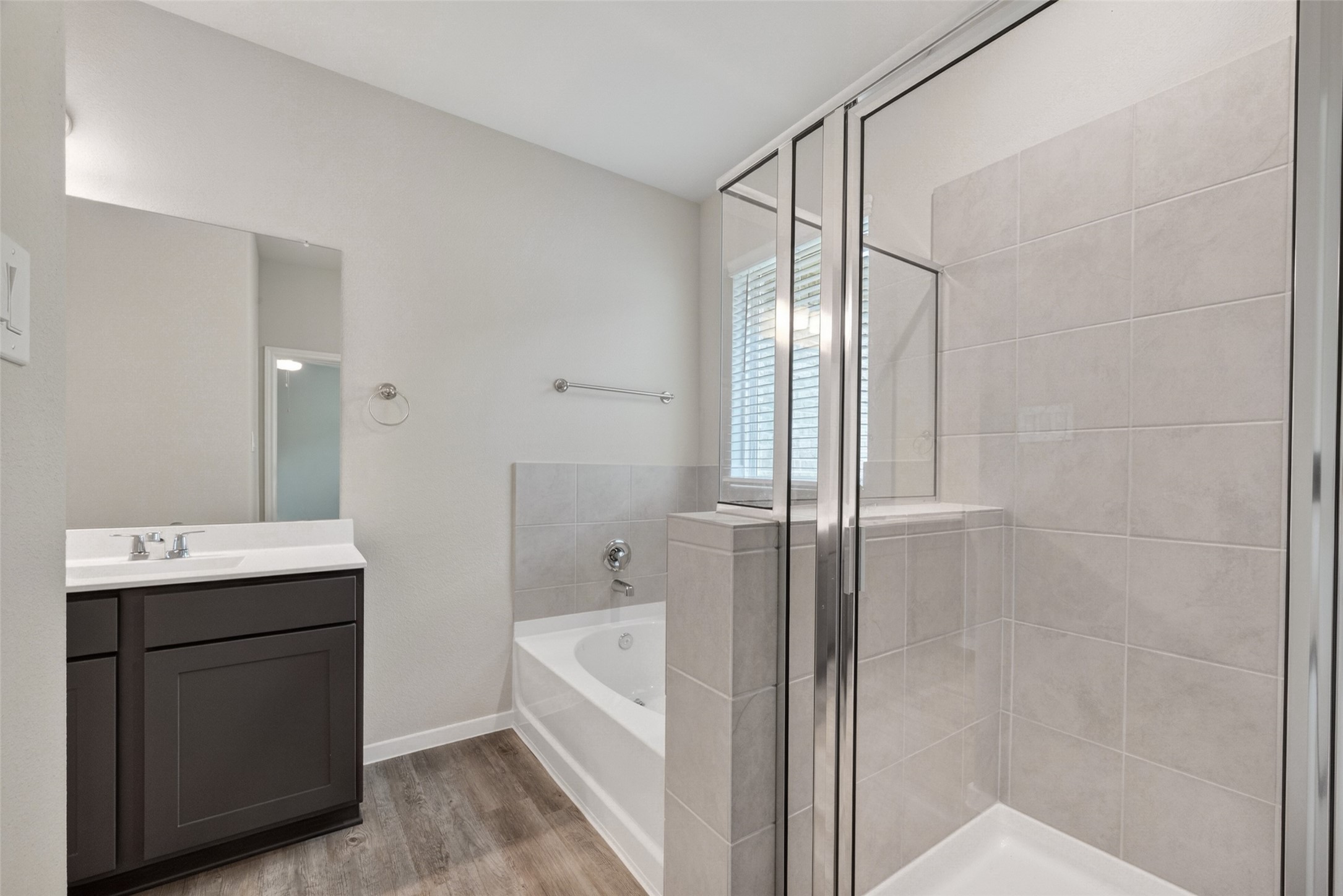 2107 Spring Hollow Drive Baytown, TX 77521 - Photo 26 of 42 a bathroom with a tub sink shower and mirror