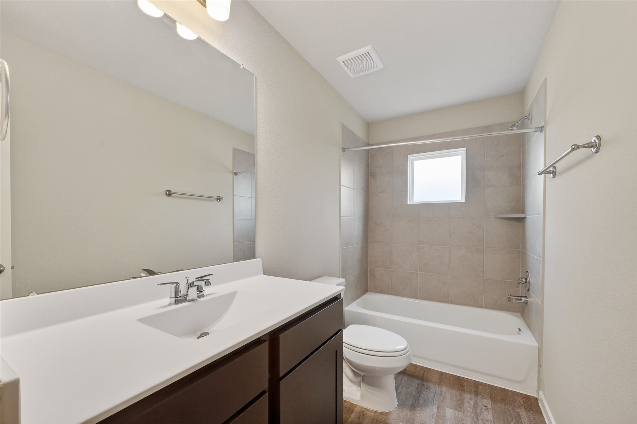 2107 Spring Hollow Drive Baytown, TX 77521 - Photo 32 of 42 a bathroom with a sink a toilet and shower