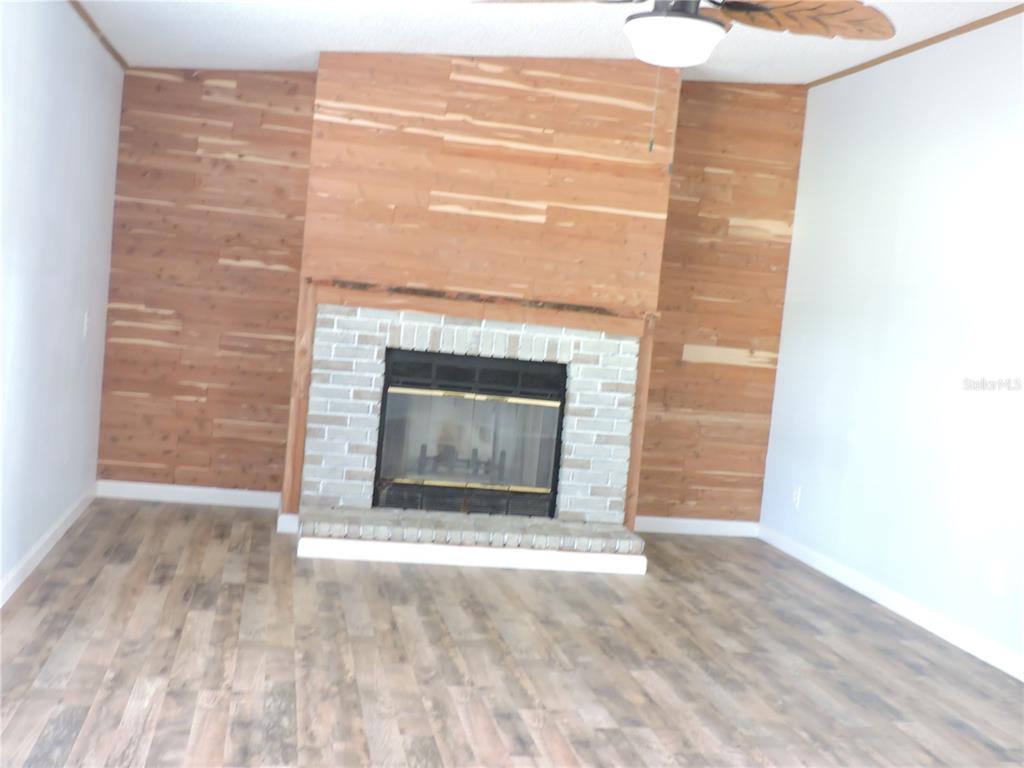294 Tiger Lake Road Lake Wales, FL 33898 - Photo 11 of 56 a view of empty room with a fireplace