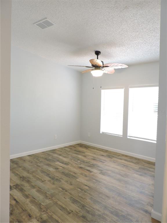 294 Tiger Lake Road Lake Wales, FL 33898 - Photo 13 of 56 wooden floor in an empty room