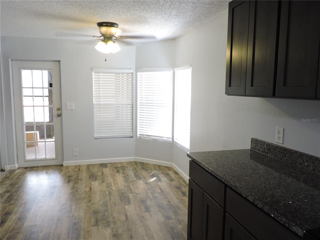 294 Tiger Lake Road Lake Wales, FL 33898 - Photo 19 of 56 a view of an empty room with window and wooden floor