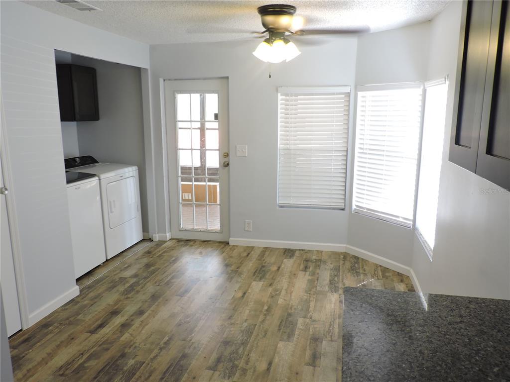 294 Tiger Lake Road Lake Wales, FL 33898 - Photo 20 of 56 a view of an empty room with a window and wooden floor